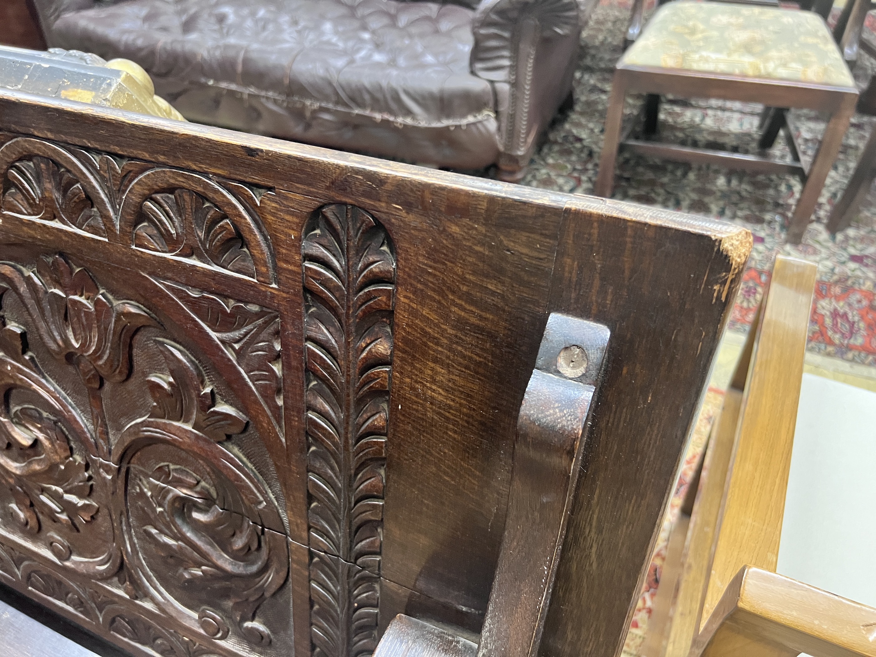 A 1920’s carved oak monk's bench, width 122cm, depth 51cm, height 78cm